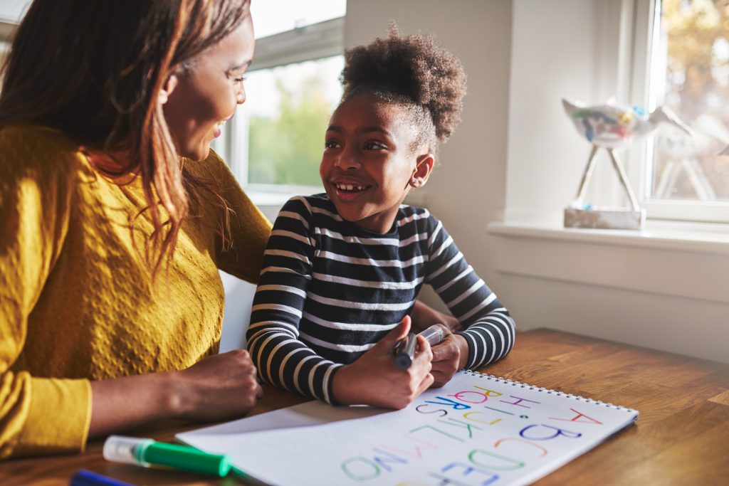 Little black girl learning to calculate for elementary school